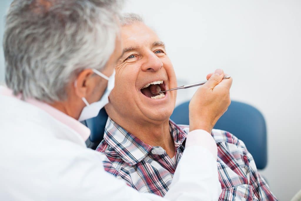 Dental Implants or Bridges for Full Mouth Rehab? Pros and Cons Explained